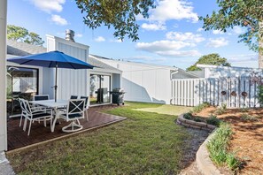 Private back lawn with propane grill