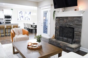 Living room with pull out sofa bed (queen). Linens and pillows provided.