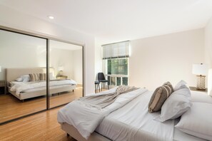 Spacious bedroom with a plush king bed—relax in total comfort!







