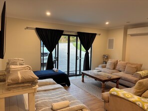Lounge room, includes two lounges you can sleep on, a day bed and fold out bed.