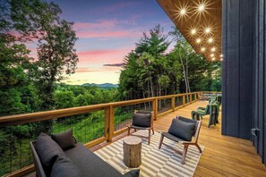Unwind on the scenic deck, offering breathtaking sunset views and comfortable outdoor seating.