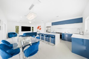 Step into a cozy retreat where style meets comfort! Enjoy the perfect spot to unwind with our inviting blue chairs and charming table. 