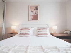 Your comfy queen bed in the master bedroom with wardrobe. 