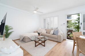 Totally comfy lounge  in the SMART TV room and backing on to the backyard patio. 