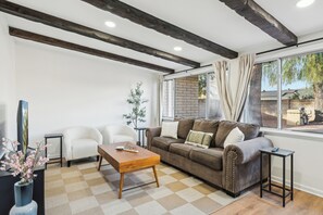 Unwind, recharge and watch some Netflix in this spacious living room just off the kitchen.