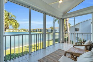 This coach home has a spectacular view of the fresh water lake in the center of the community 