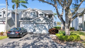 The front of the coach home - it has the empty driveway