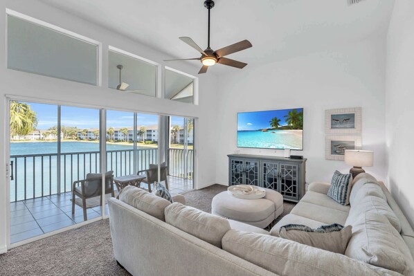 The family room has a wonderful view to the lake as well as access to the screened lanai 