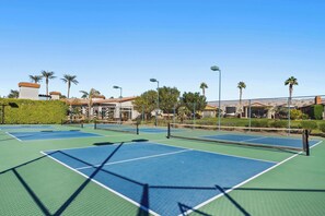 Break out the rackets & enjoy a round of tennis at the community courts