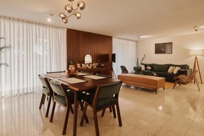 Dining and living area with access to a balcony and panoramic view