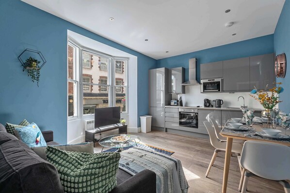 A bright and inviting living room, beautifully decorated with stylish touches.