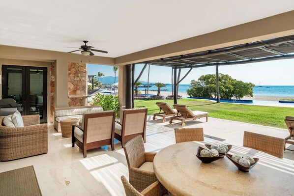 Fall in love with our spacious ocean-view terrace—just steps from the beach