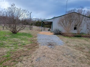 gravel parking spot next to the house