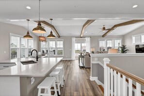 Expansive top floor with modern kitchen, huge dining, and comfy living room!