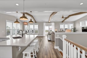 Expansive top floor with modern kitchen, huge dining, and comfy living room!