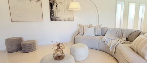 Spacious lounge room with large Sofa and Armchairs