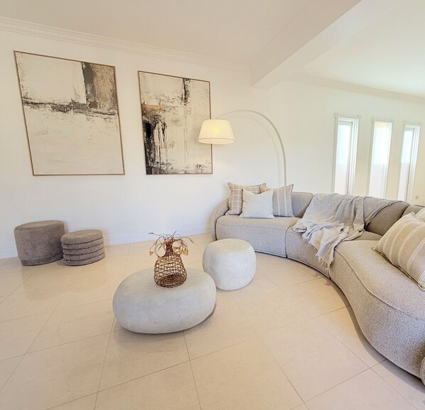 Spacious lounge room with large Sofa and Armchairs