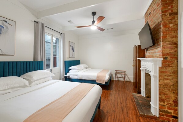 Bedroom #1 - Spacious bedroom with two queen beds, top-rated linens, and historic details
