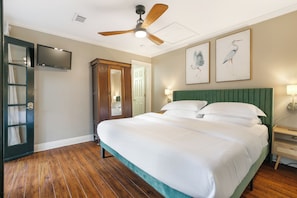 Bedroom #2 features a luxurious king-size bed and offers direct access to a shared Jack-and-Jill-style bathroom.