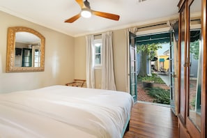 Bedroom #2 features a luxurious king-size bed and offers direct access to a shared Jack-and-Jill-style bathroom.