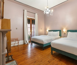 Double queen bedroom with chandelier