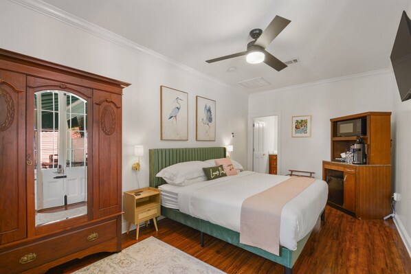 Serene king bedroom with elegant furnishings and blackout curtains for restful nights