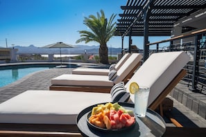 Comfortable and modern lounge chairs make the perfect sun bathing spot.