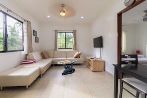 A big Living Room with Cables Smart TV