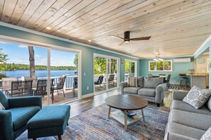 Upper living room with views of the lake and access to the upper deck