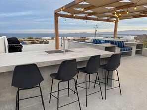 Rooftop BBQ, sink, and mini fridge. Perfect for a sunset drink or dinner (2)