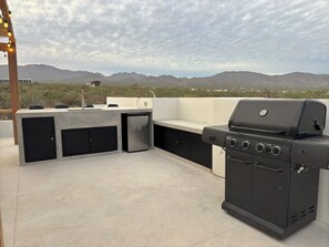 Rooftop BBQ, sink, and mini fridge. Perfect for a sunset drink or dinner (1)