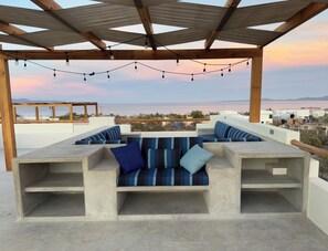 Enjoy stunning sunsets over the mountains from the love seat—or your very own sunset throne