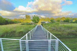 Steps from your back patio, open the gate and walk the boardwalk to your private dock & boat lift.