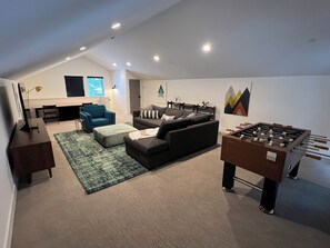 Large Bonus room above garage with foosball table