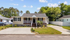 Parking is provided in the driveway right in front of the house. Note: The driveway to the right is for those staying in Unit "B" of this duplex.