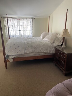 Queen bedroom (b) overlooking parking lot and upper pasture
