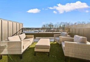 Step outside to this inviting seating area, where you can sip your morning coffee, enjoy a good book, or watch the sunset with stunning lake views as your backdrop.