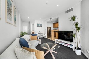 Living, Dining, and Kitchen: Open Concept Layout with Modern Comfort and Style