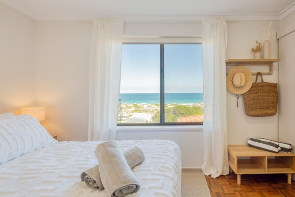 Enjoy panoramic ocean views from the moment you open your eyes.