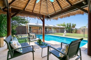 Chill out under the gazebo while dipping into the salt water pool