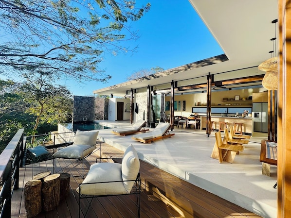 The property private terrace and pool w/ mature trees where monkeys often come