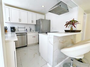 Spacious countertops and sleek design create the ultimate vacation kitchen.