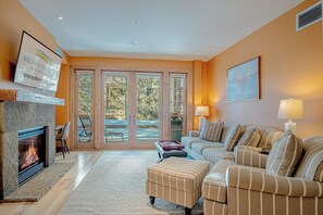 Step our to a private patio with outdoor furniture and BBQ grill