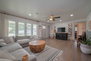 Spacious living room with piano too