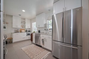 Bright fully equipped kitchen.