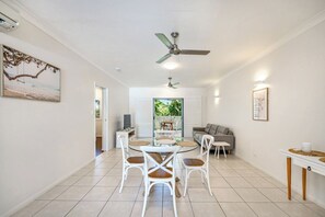The bright and airy lounge and dining area provides ample space to unwind or share meals with family and friends.