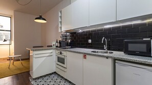 With modern appliances and tasteful design, our kitchenette is the perfect space to cook a delicious snack #practical #colorful