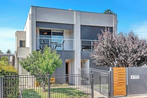 Modern townhouse with a private balcony, located just 400 metres from Grange Beach.