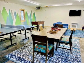 The new garage game room is perfect for unwinding after a day of adventure. Play ping pong, foosball, or a card game—fun and friendly competition for everyone!