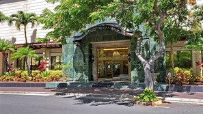 Elegant Green and pink marble entrance to building with gold leaf accent